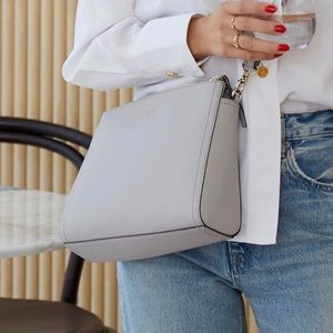 Lo & Sons The Pearl Crossbody. Color: Rose Grey. Versatile bag. Stores a…